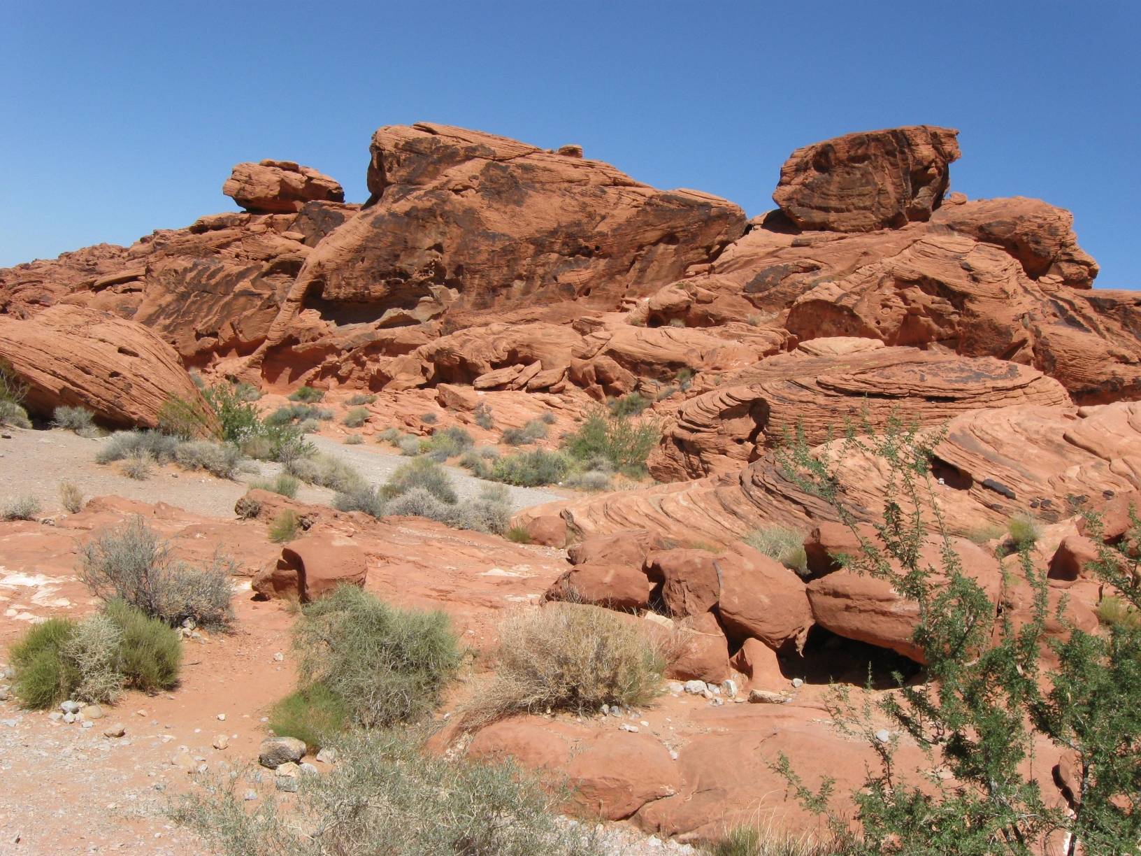 Image: A red sandstone rock formation near the western entrance to the park