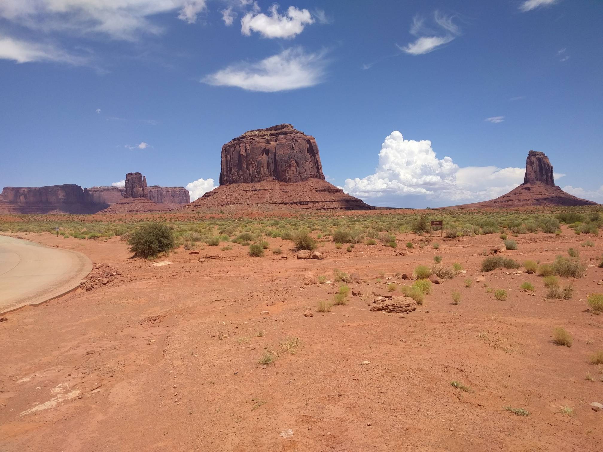 Image: A view of the West Mitten (left), Merrick (center), and the East Mitten buttes (right) from the Valley Road