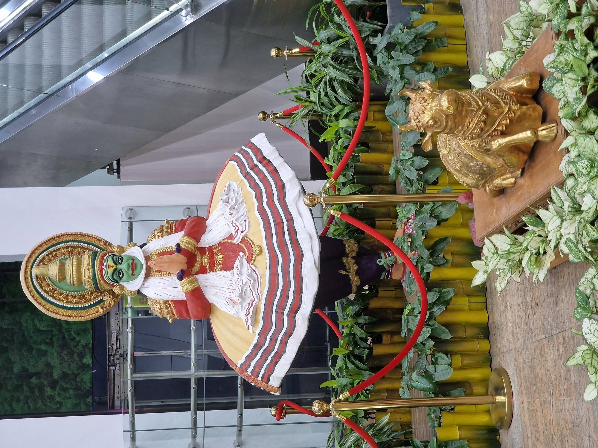 Statues of a Kathakali dancer (top) and Nandi, the sacred vehicle of Lord Shiva