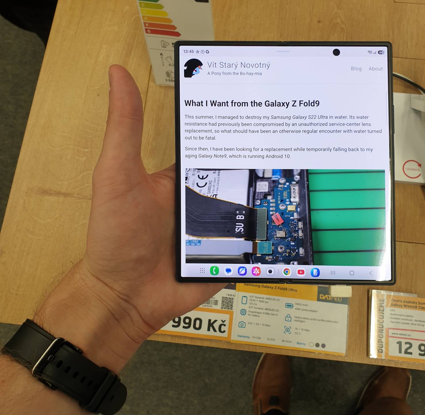 Me holding a Samsung Galaxy Z Fold8 Ultra that displays this article