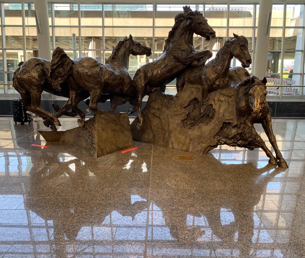 A horse statue in the hall near Arrival Door 14 at Calgary International Airport